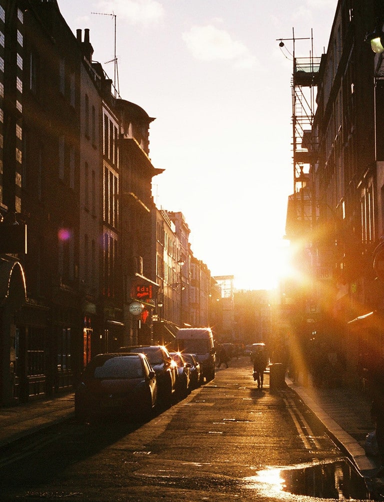 sun shines and lights up a city street