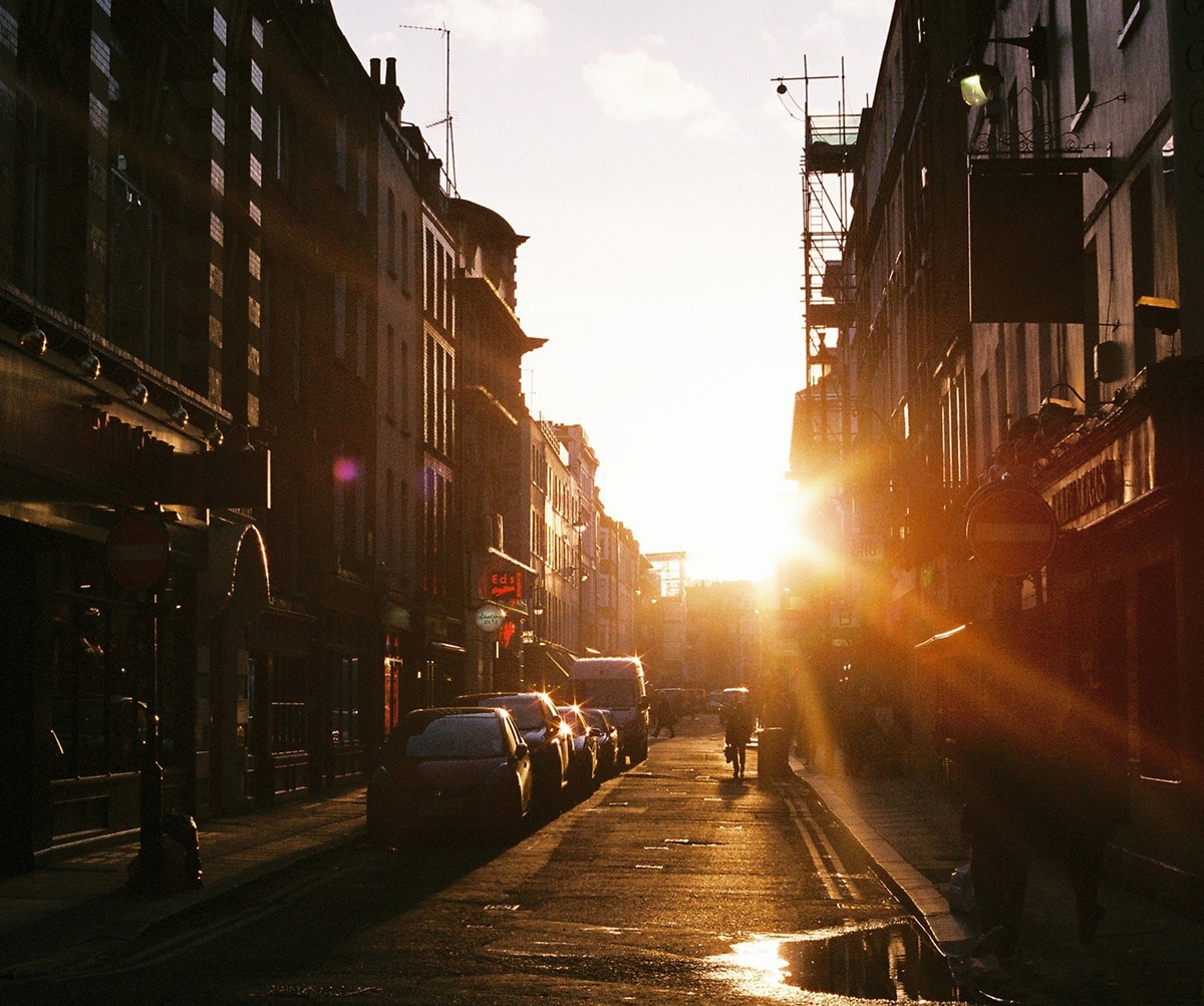 sun shines and lights up a city street