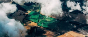 an aerial shot of wind turbines representing one type of renewable energy from 3Degrees