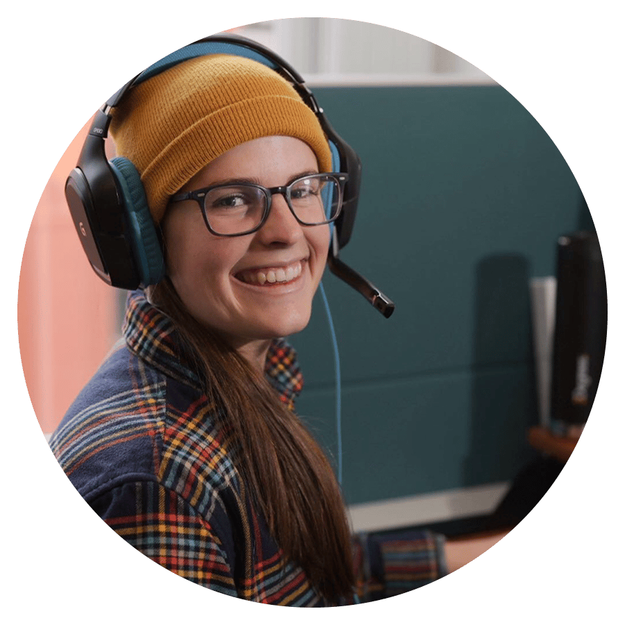 Photo of a 3Degrees employee with a set of headphones on smiling