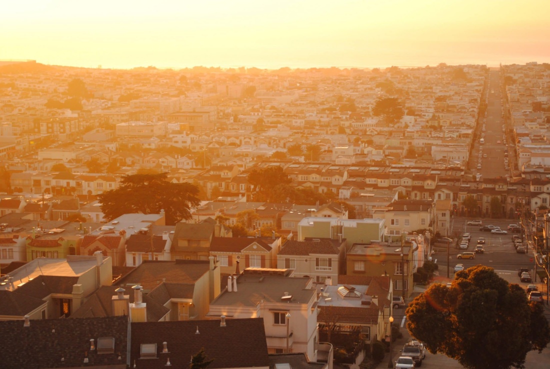 Neighborhood lit by orange sunlight